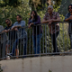 the six members of foo fighters standing on a ledge